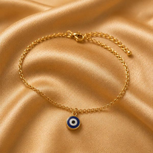 Gold bracelet with evil eye charm