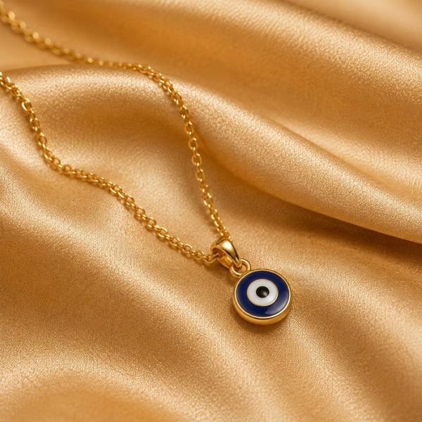 Gold necklace with evil eye pendant
