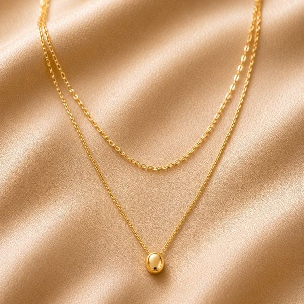 Layered necklace with bead pendant